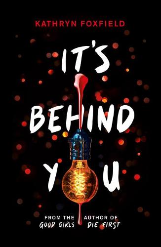 Book cover for IT'S BEHIND YOU: title in white on flecked black with a lightbulb dripping blood